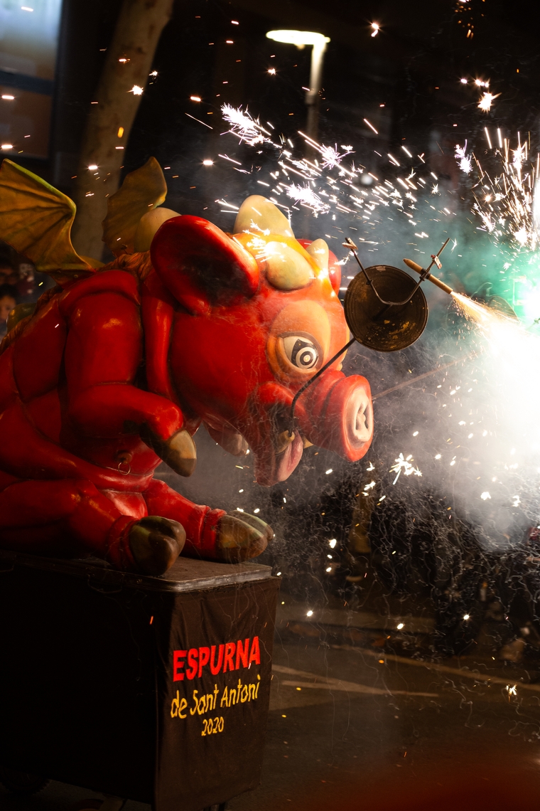 A large pig statue sprays sparks